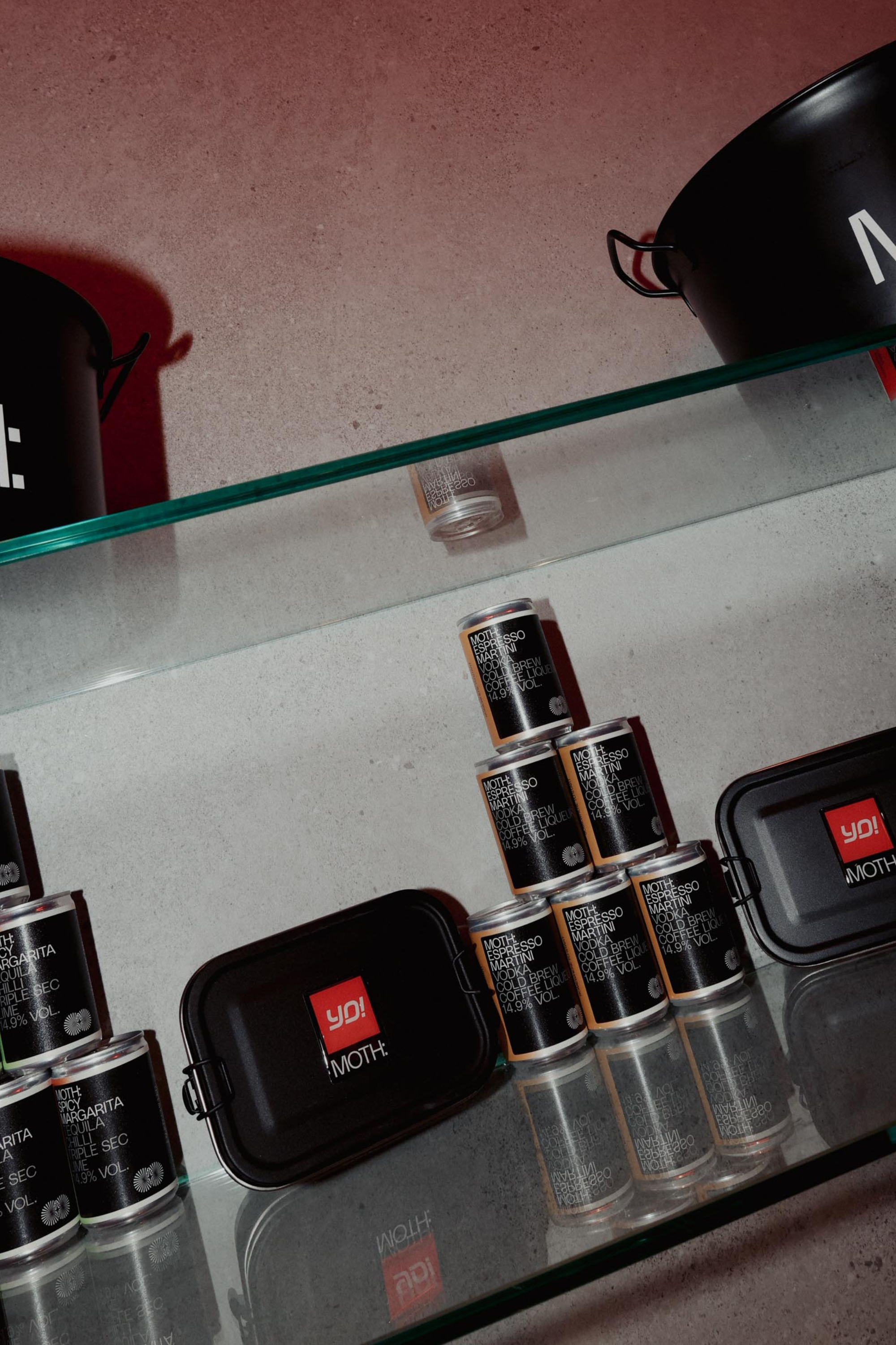 Shelves displaying various cans and containers with branding.