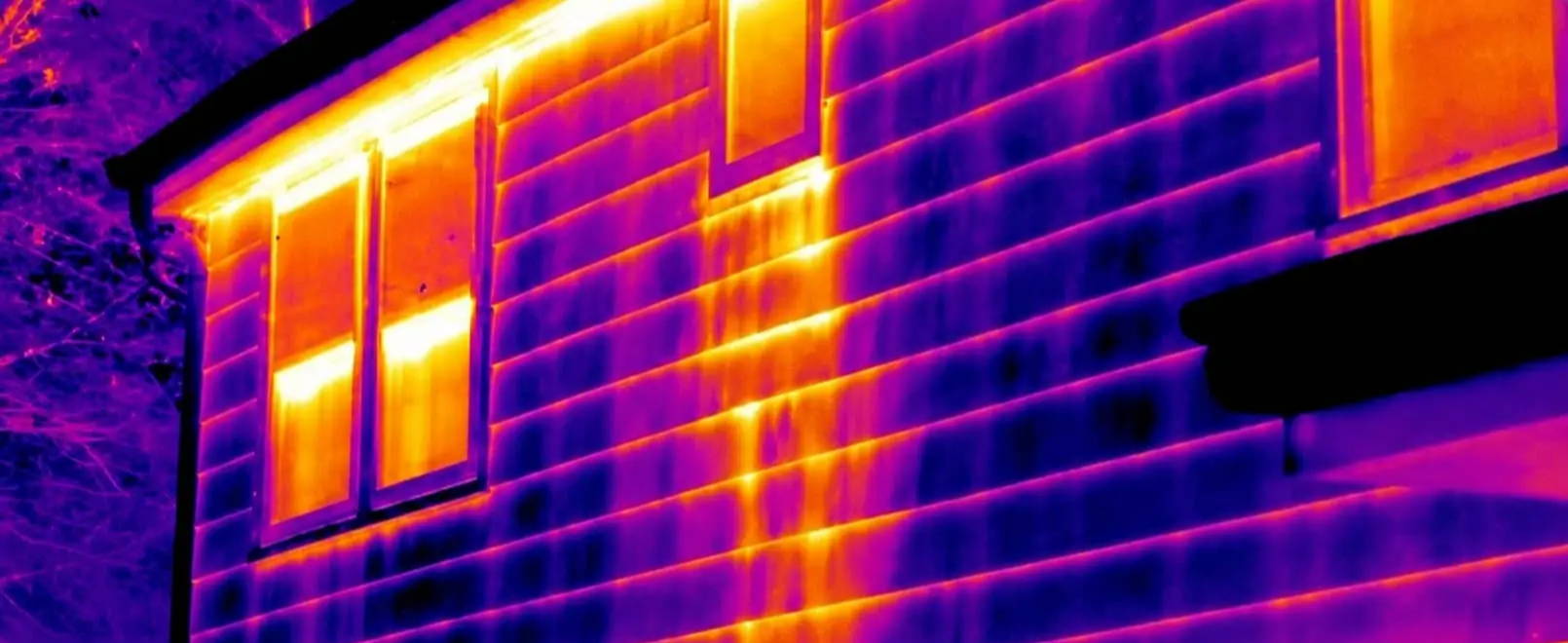 Thermal image showing hidden damp and moisture patterns on a building exterior