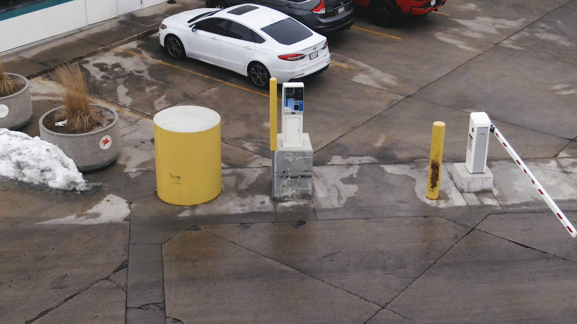 Truck stop parking lot entrance with a gate arm and pay station