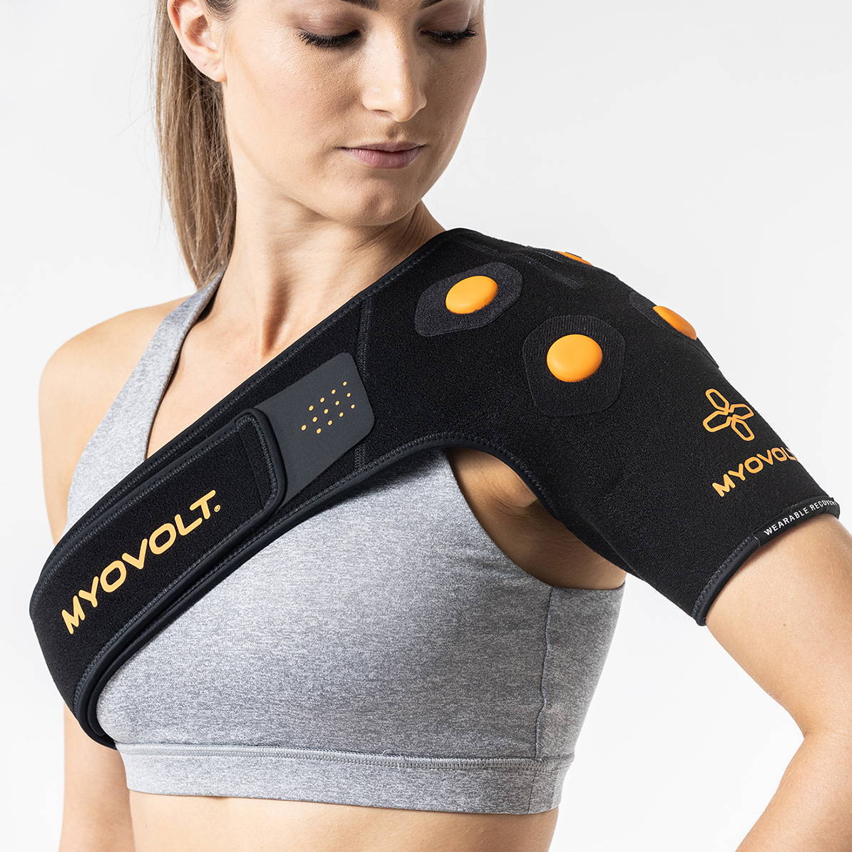 Myovolt vibration therapy shoulder brace relieves muscle pain and stiffness from Swimmer’s Shoulder, Frozen Shoulder and sports overuse injury. Wearable rehabilitation treatment for left or right shoulder.