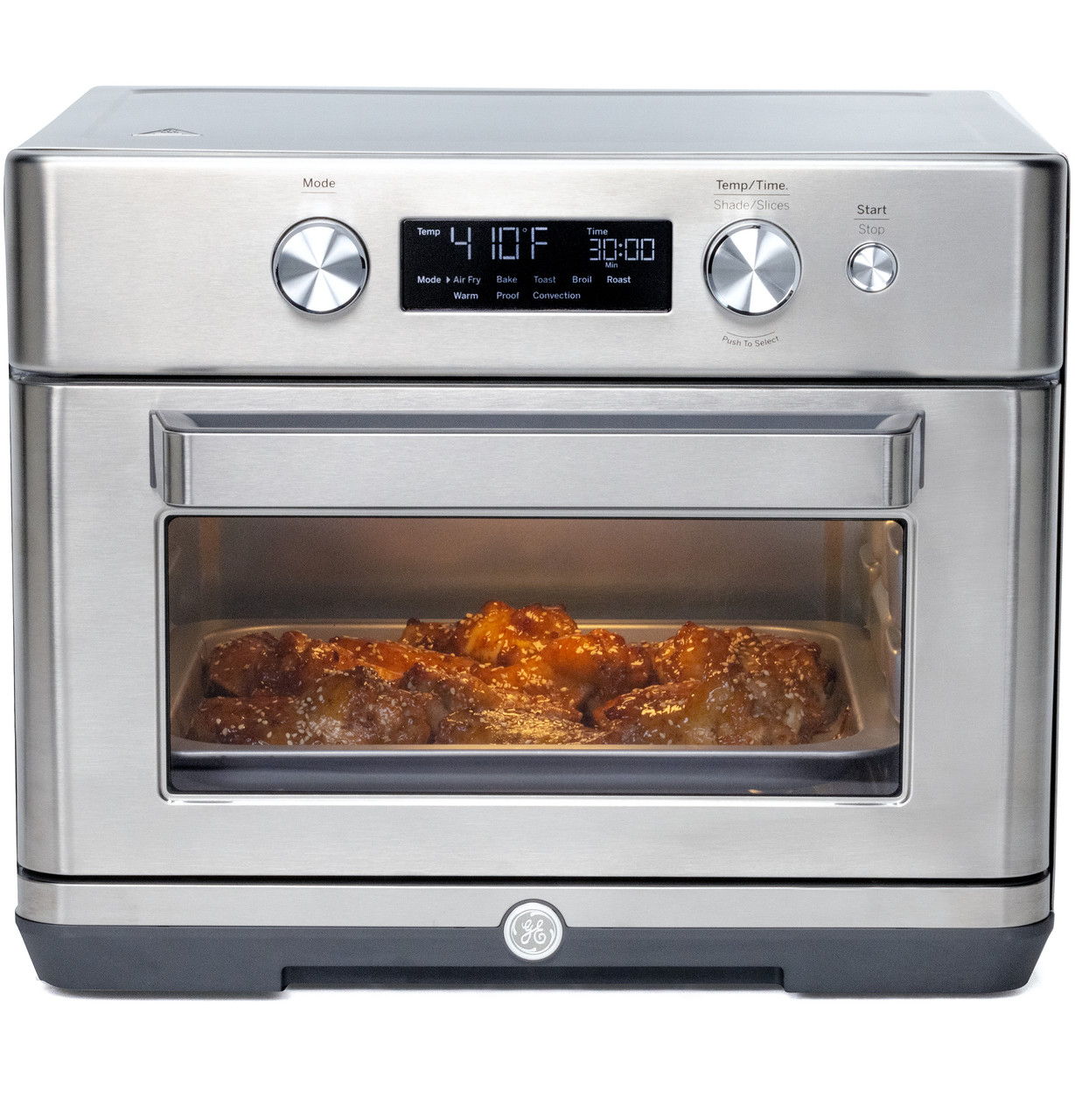Stainless steel air fryer oven with digital display and food inside.