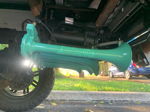 Close-up teal HornBlasters train horns mounted on undercarriage of Caitlyn's Silverado photo 4