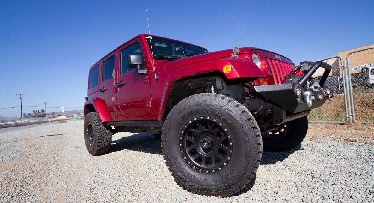Method 306 Wheels on Red Jeep Close