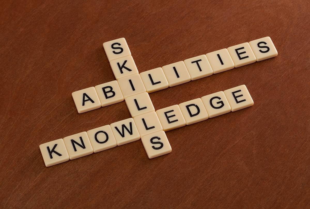Scrabble works spelling out skills, abilities, and knowledge