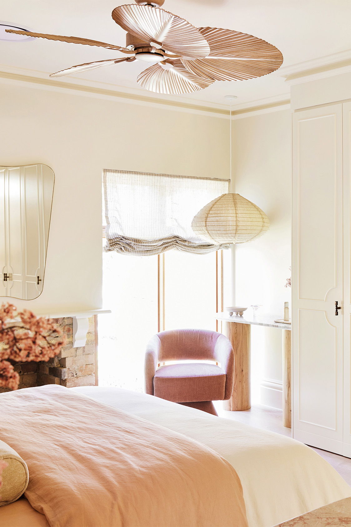 Cozy bedroom with a light color scheme and stylish decor elements.