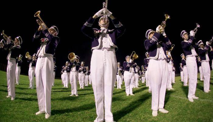 Marching band playing outside on field