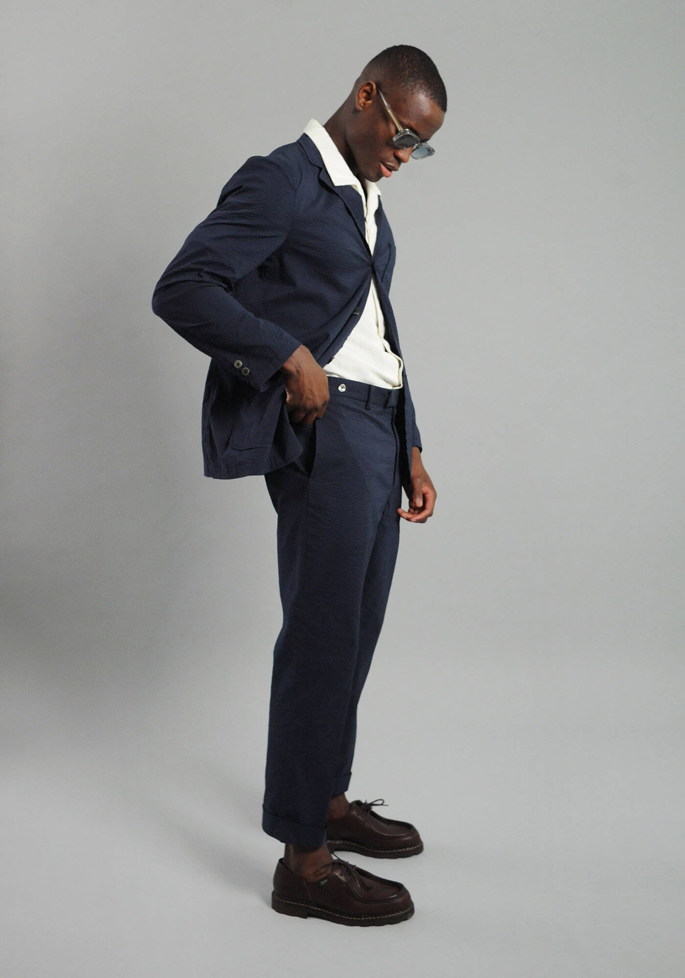 A model wearing a look from the SS24 Tailoring menswear campaign.