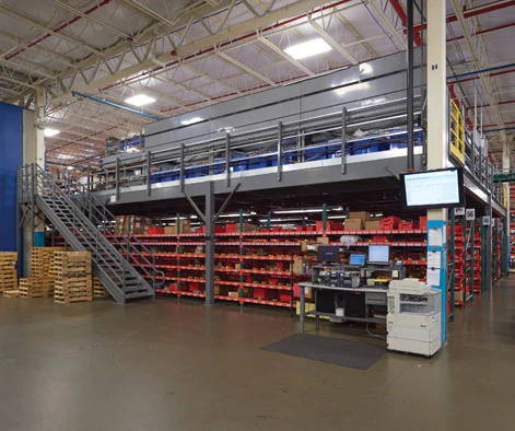 Storage mezzanine installed in auto parts retailer warehouse.