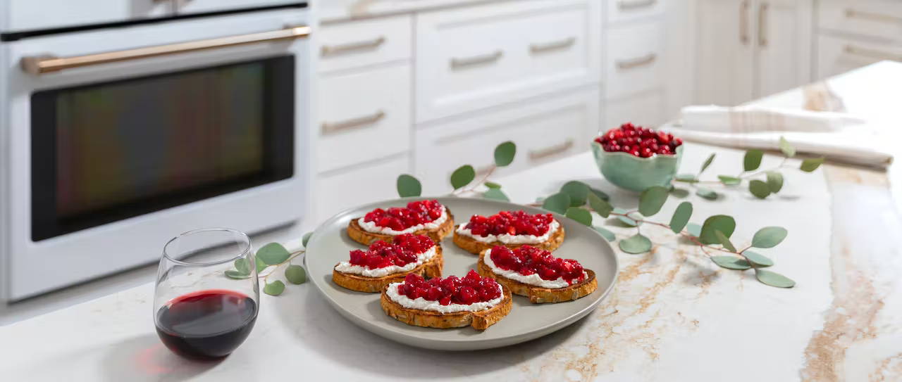 cranberry chèvre crostini on island with garland 