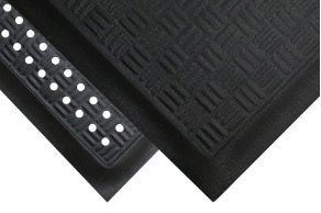 Two black rubber mats with textured patterns and raised dots.