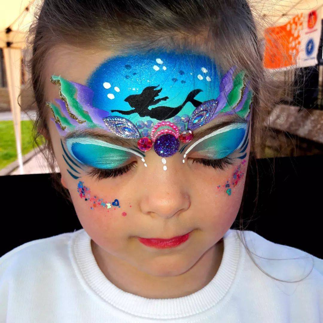 mermaid face paint forehead and mask design with stencil