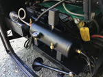 Single black train horn mounted under Chuck's RV chassis photo 2