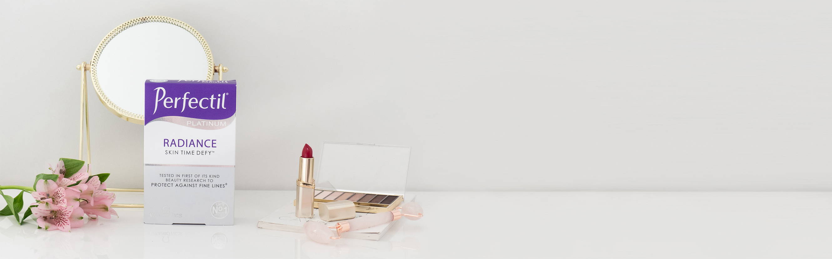 Perfectil Radiance Packshot With A Mirror, Lipstick & Eyeshadow Around It