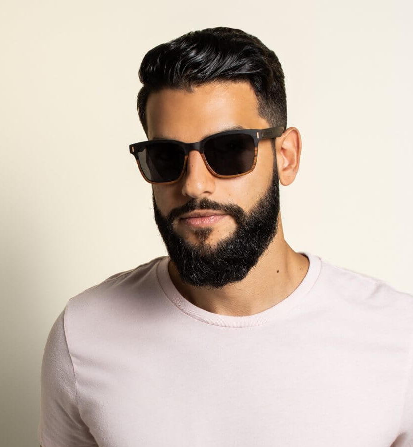 man with oval face wearing Oxford square sunglasses on a white background