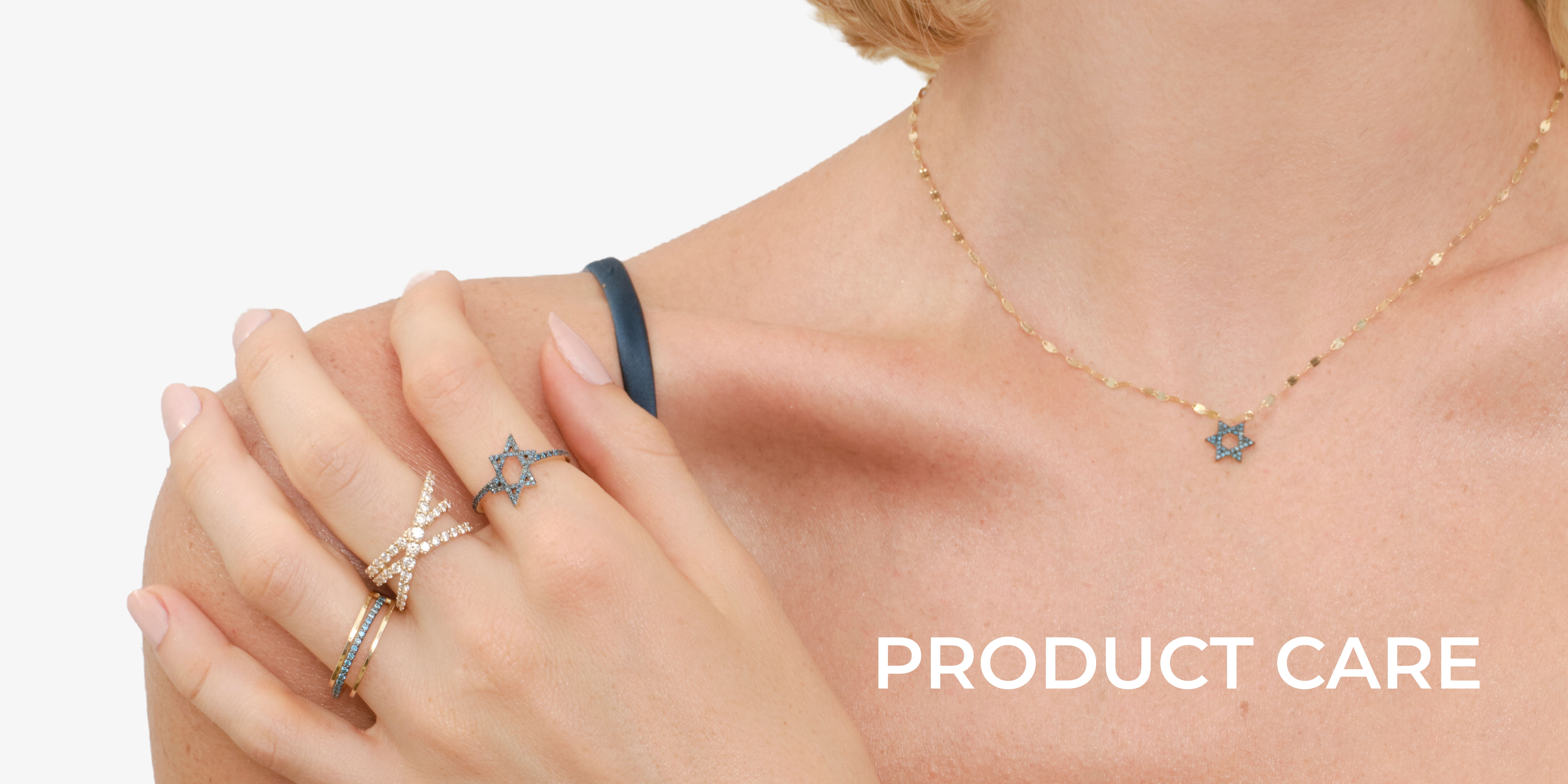 Woman wearing jewelry, showcasing rings and a necklace; text reads 