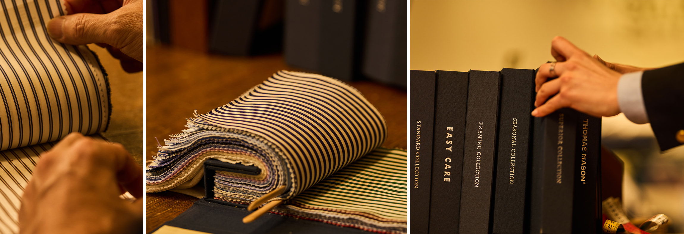 Hands examining fabric swatches and organized books on a table.