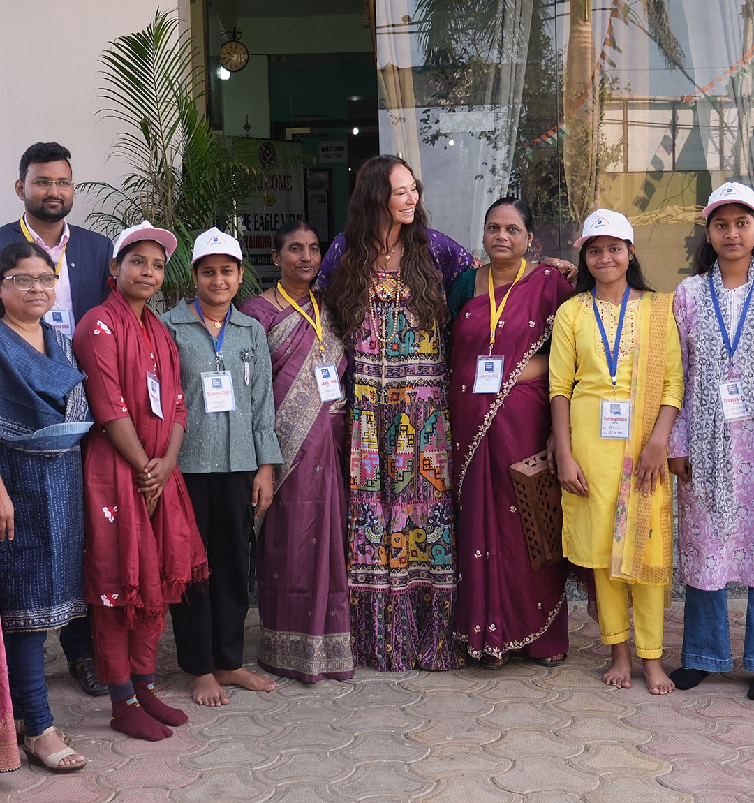 Camilla Franks, Founder and Creative Director, at the centre of a group from The Hunger Project's Adolescent Girls Program in Bihar.