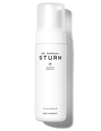 A white bottle of Dr. Barbara Sturm cleanser with a pump top.