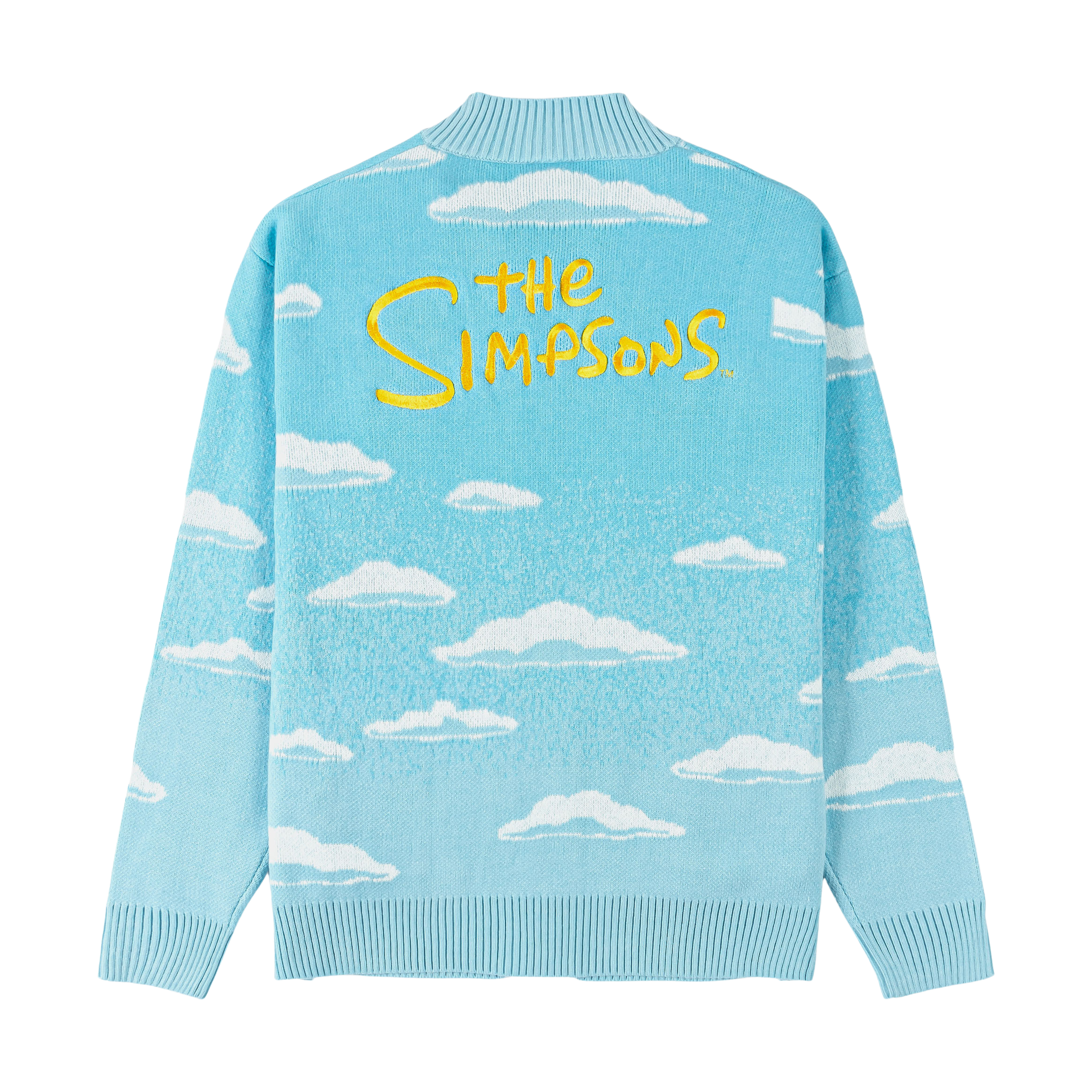 Light blue cardigan with cloud patterns and cartoon characters in the pocket.