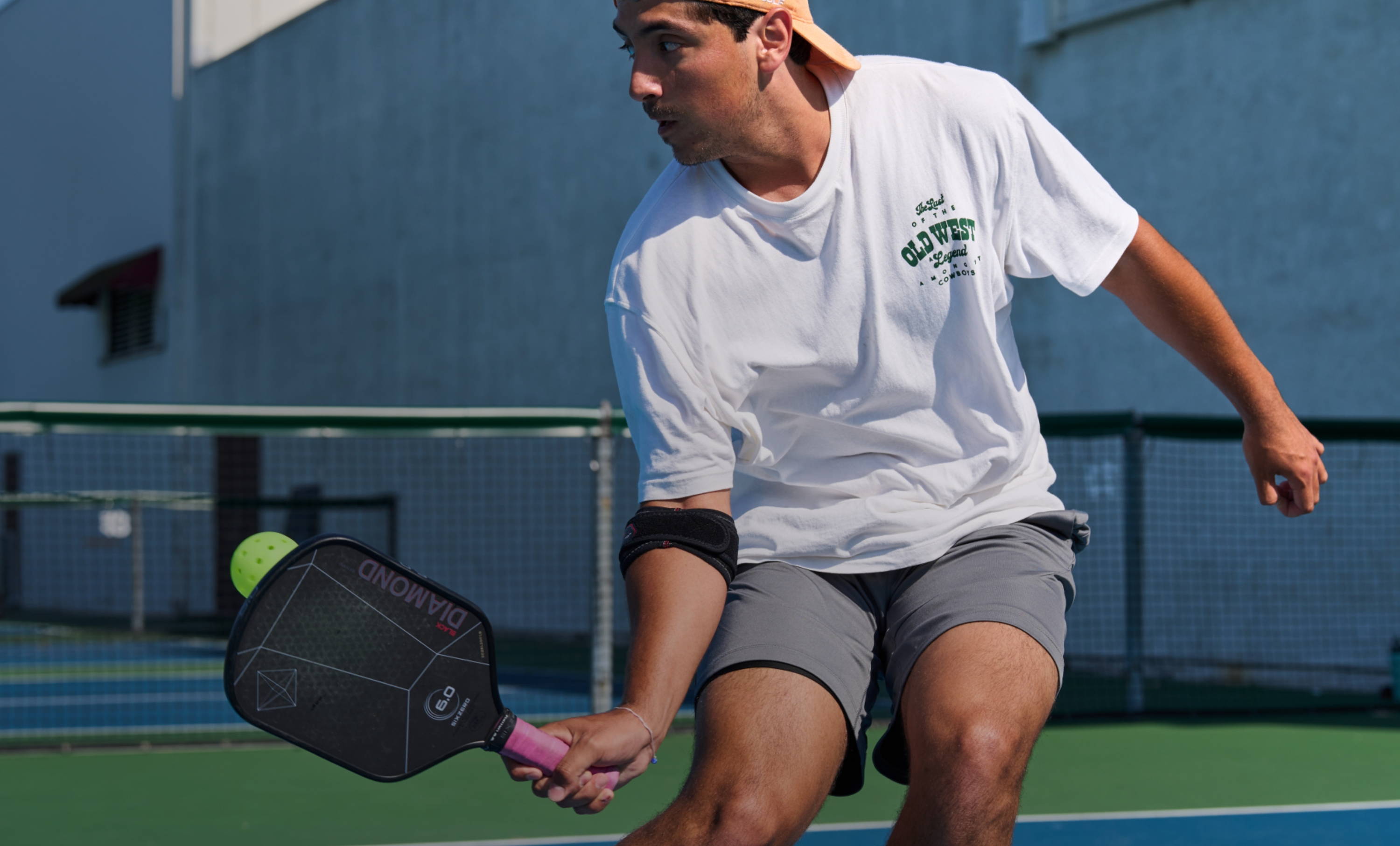 Pickleball Athlete Wearing McDavid Elbow Strap With Pads