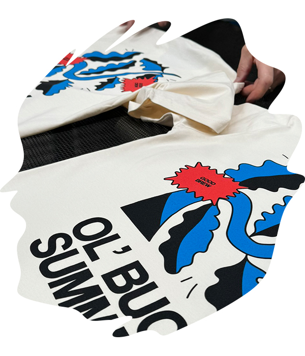 Cream white t-shirt with bold spot colour screen printed graphic featuring blue and red shapes and 