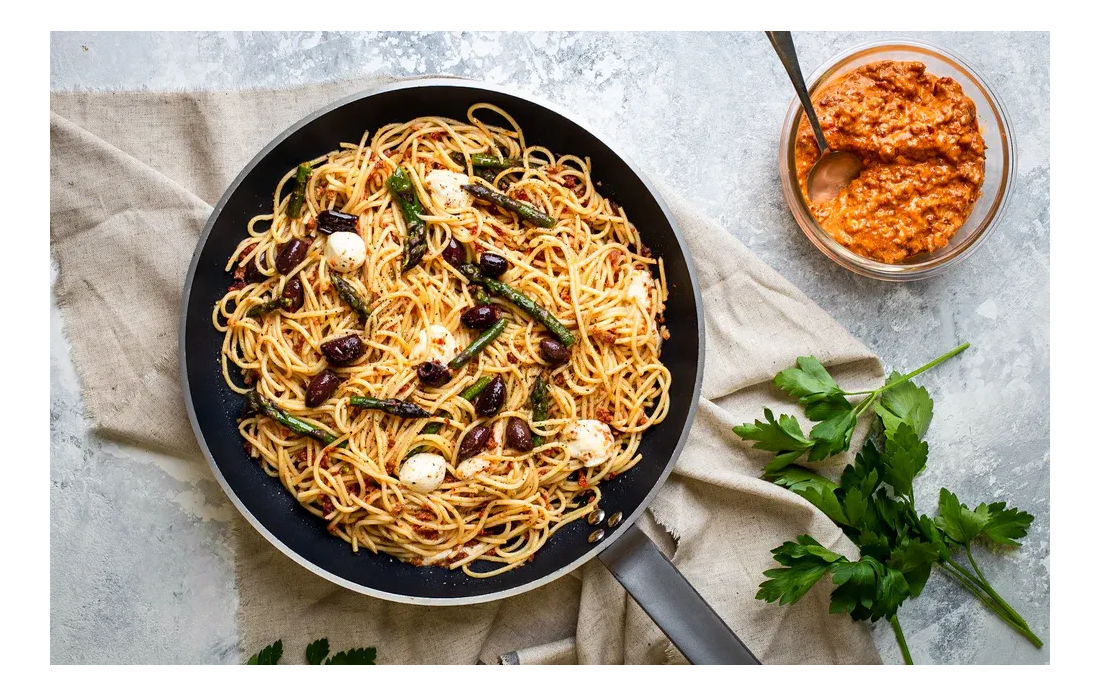 Spaghetti pasta in a large pan.