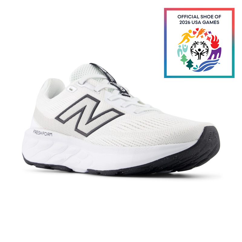 White athletic shoe with black accents, featuring the New Balance logo.