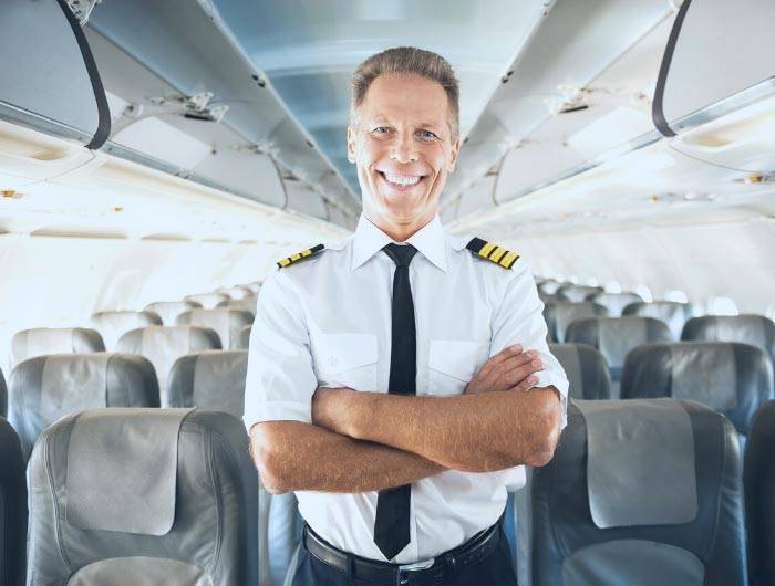 Pilot wearing a black pre-tied necktie