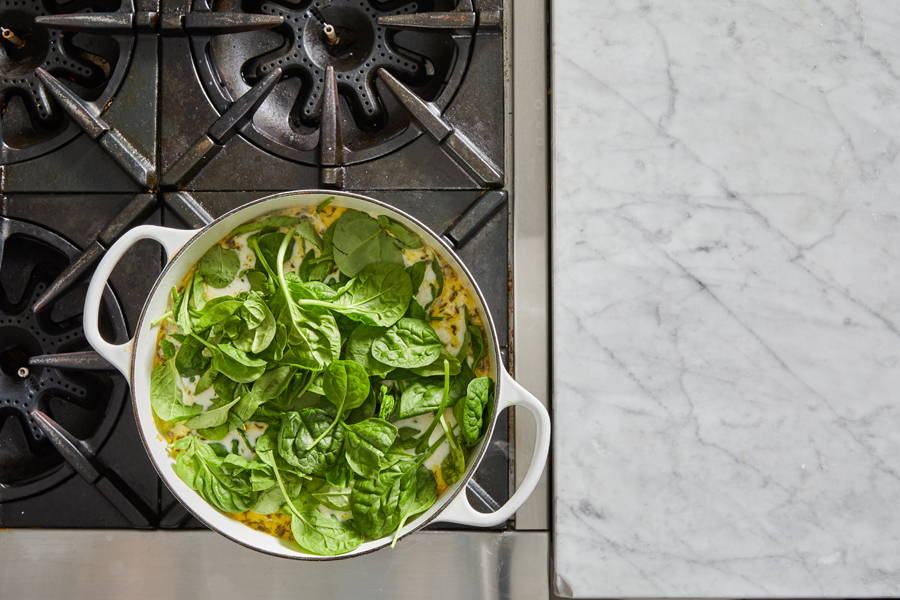 Spinach cooking in soup