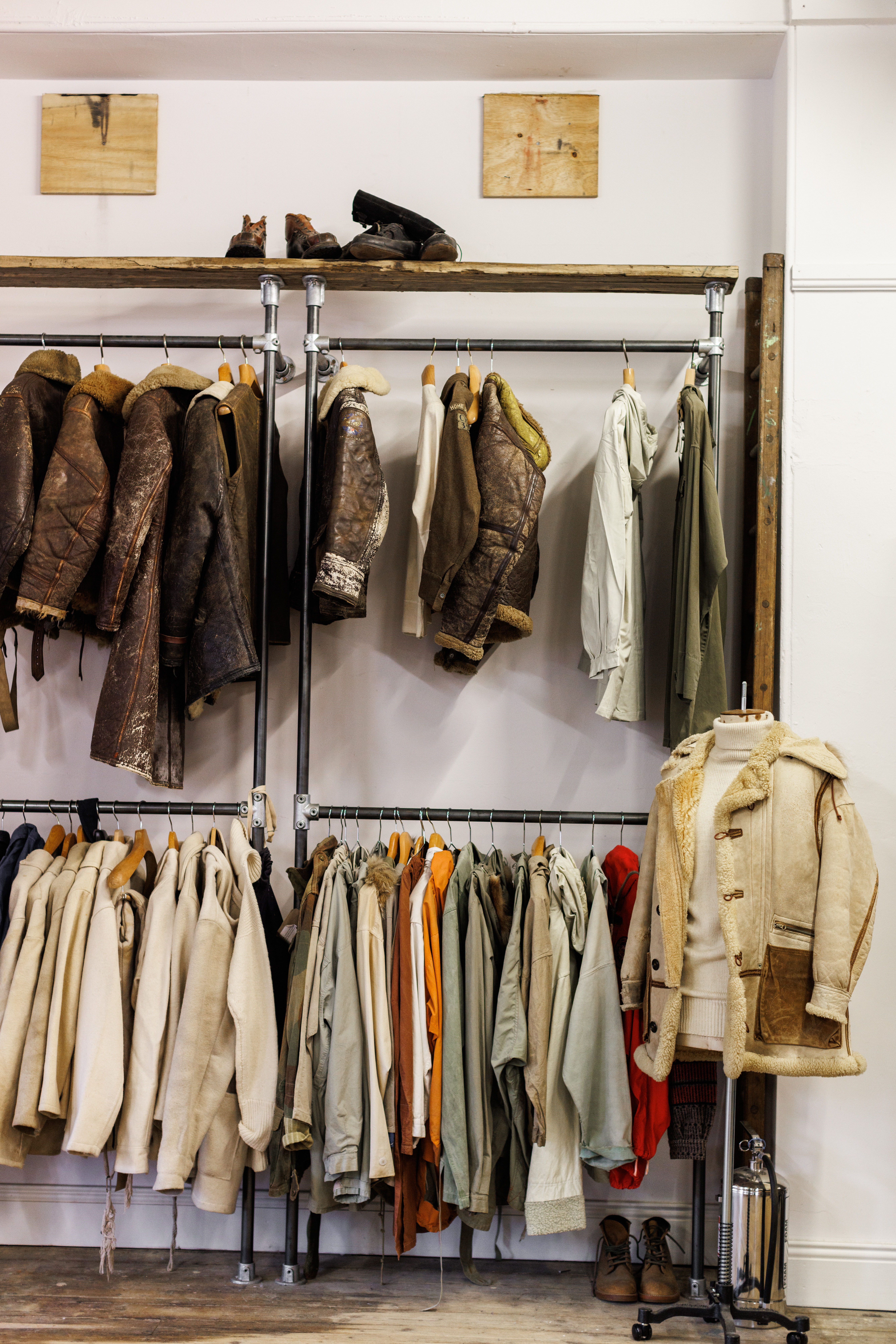 A rack of various clothing items, including jackets and coats.