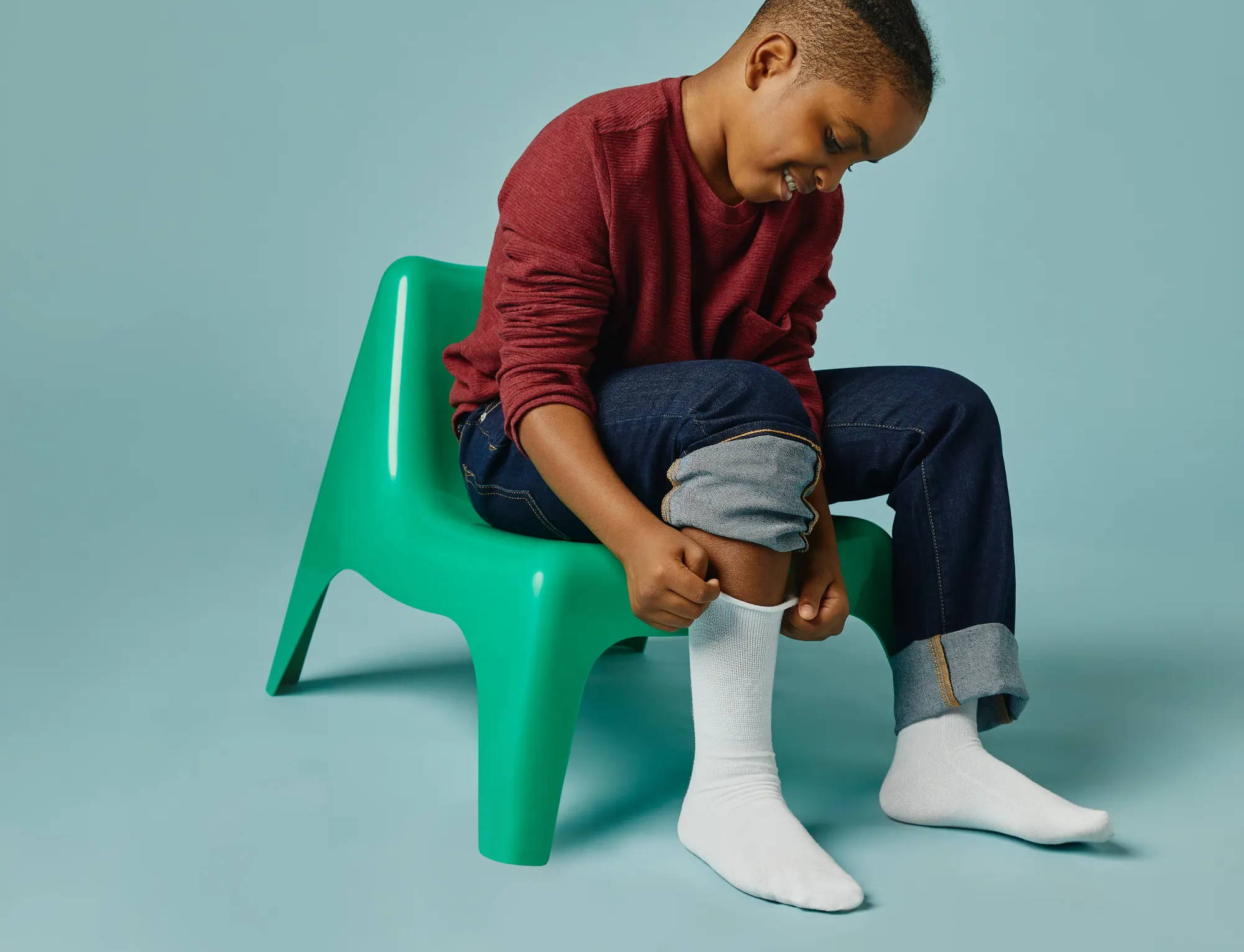 Boy wearing White SmartKnitKIDS socks, Truly Seamless