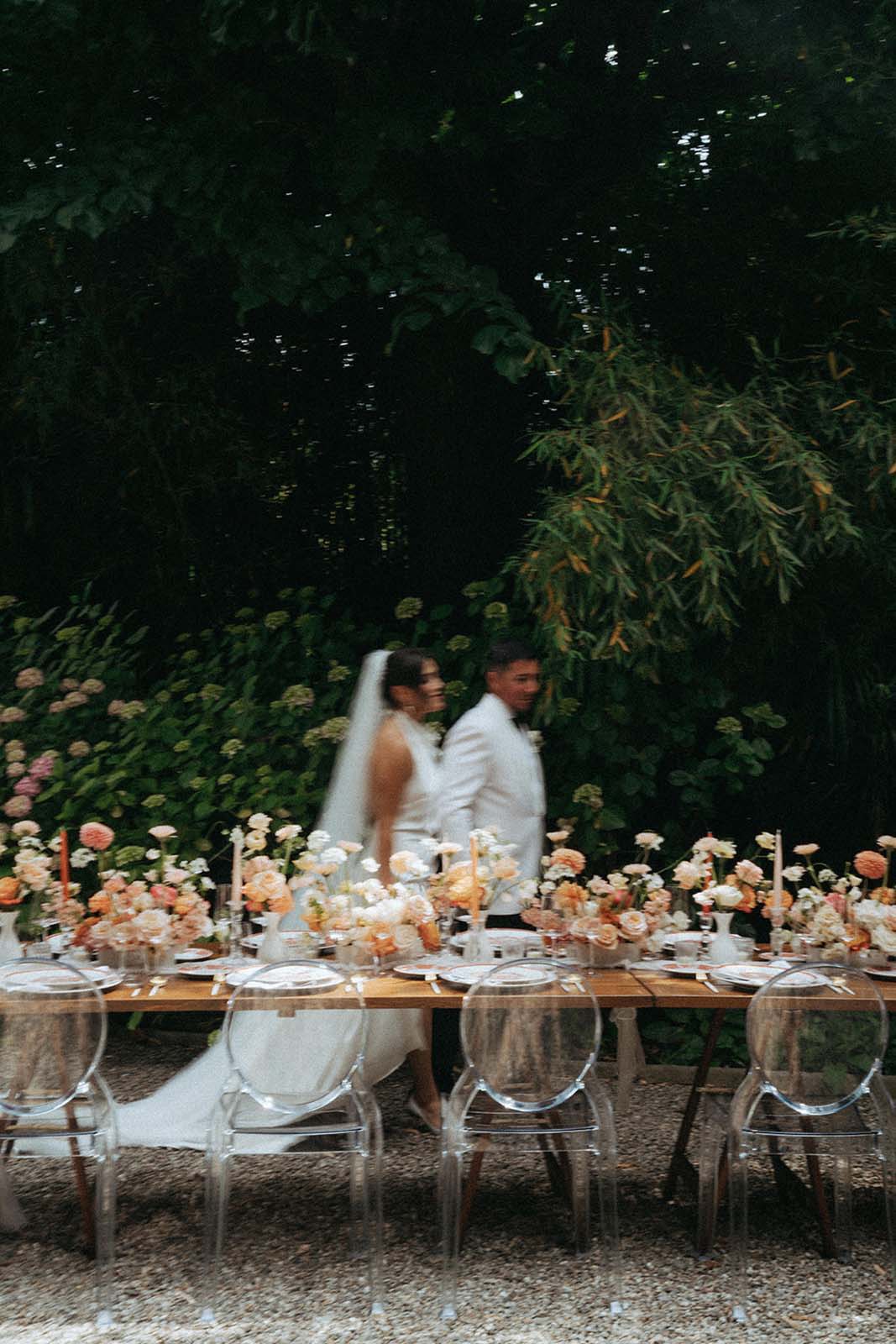 Enchanting Bride and Groom Amidst a Beautiful Wedding Table Setting