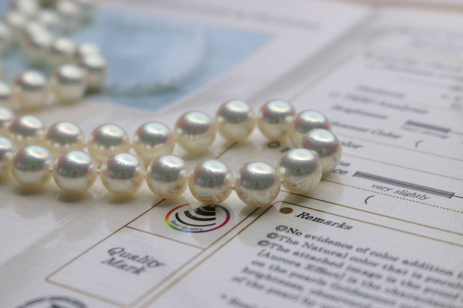 Close-Up of Hanadama Pearl Necklace on  Pearl Science Certificate