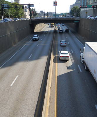 A four-lane highway divided by a raised center median.