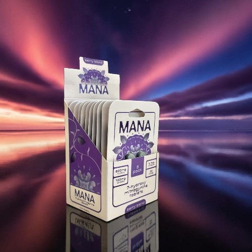 A pack of Mana cards against a colorful sunset background.