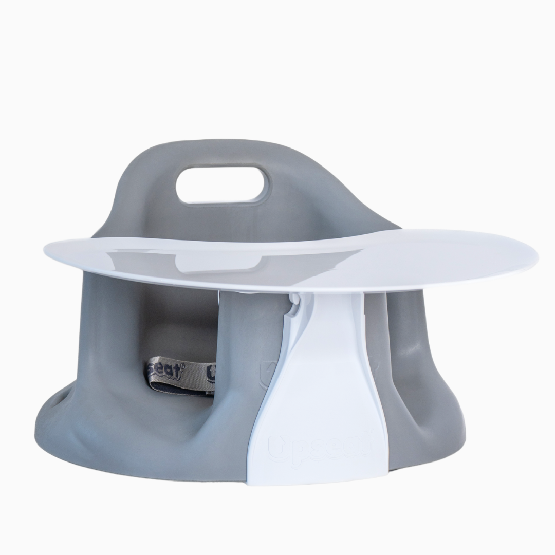 Child's feeding chair with a gray base and white tray.