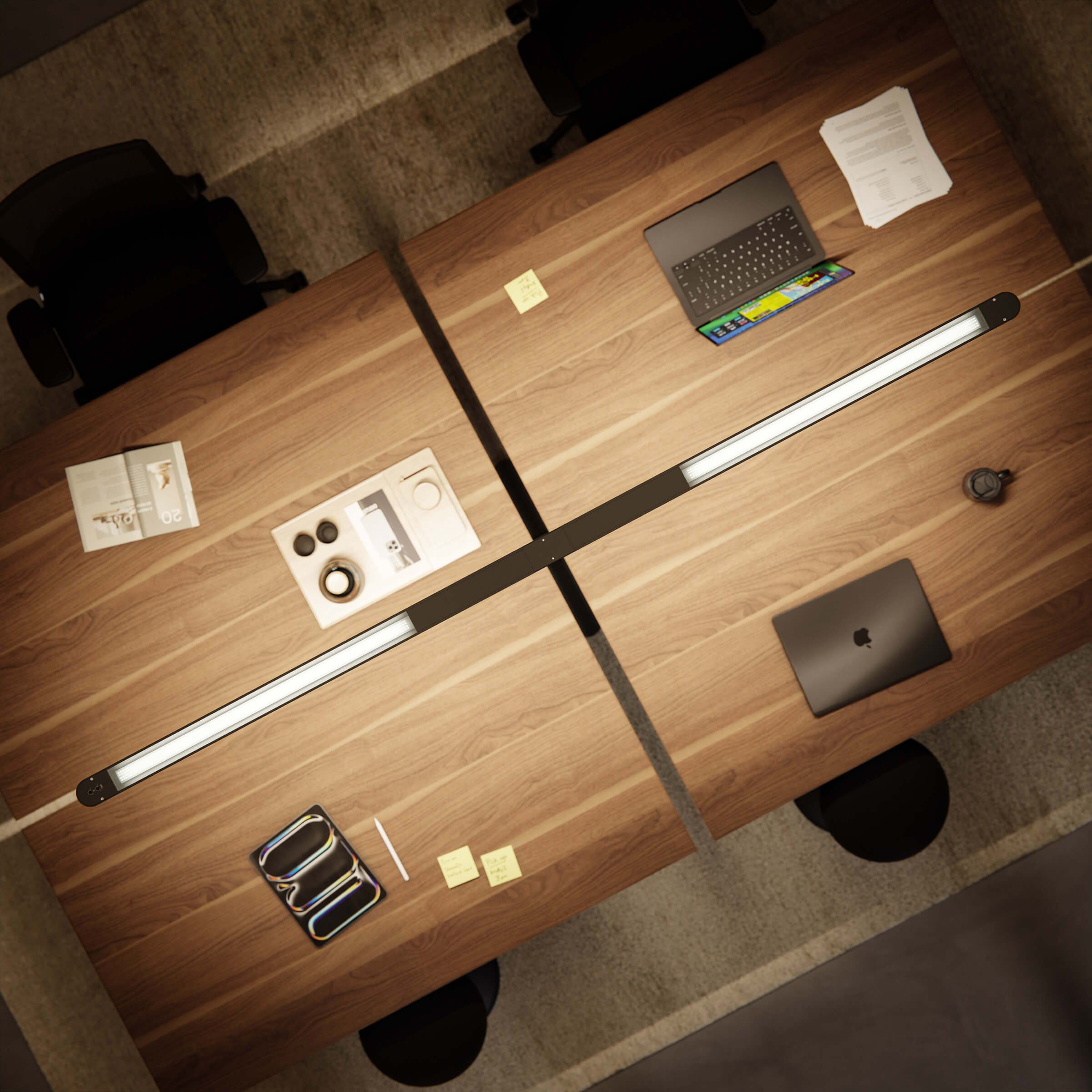 A bird's-eye view of a sleek, modern Lumino Pro set up between four workstations to create perfect lighting