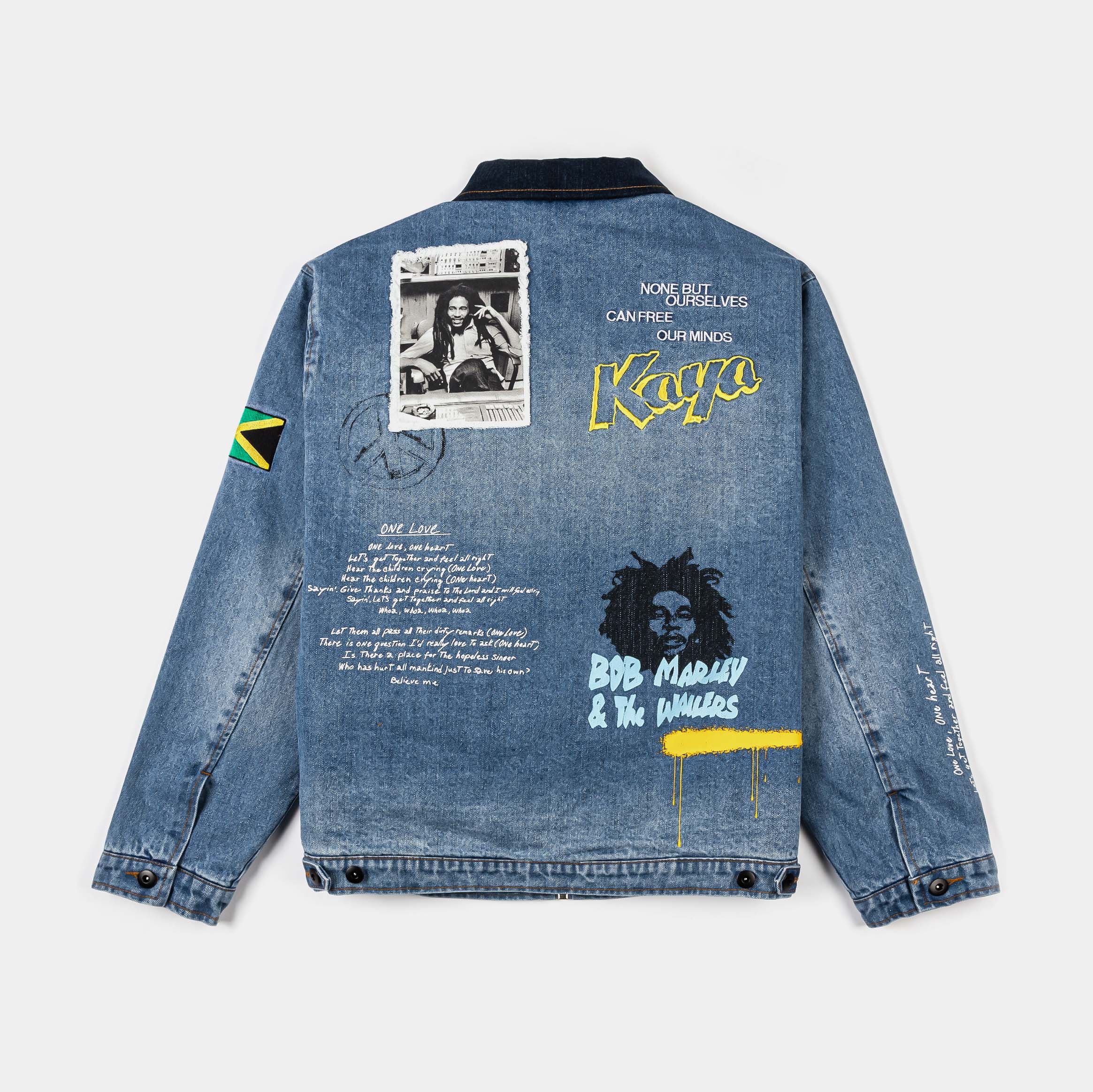 Denim jacket with graphic prints and Jamaican flag detail.