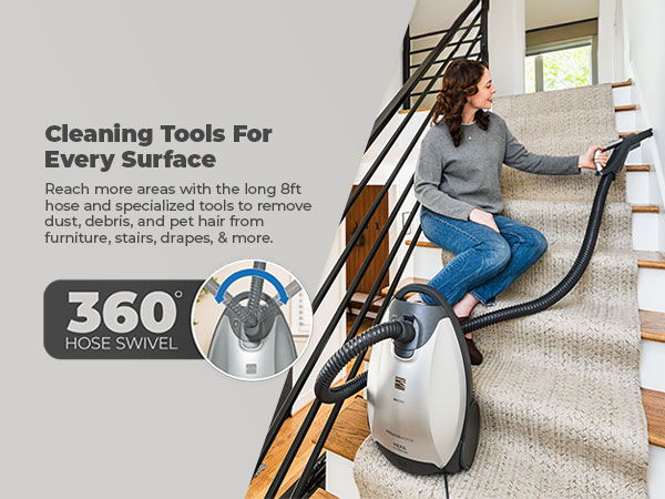 Woman using cleaning tools on stairs, promoting versatility for various surfaces.