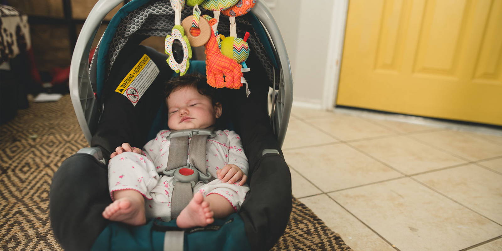 Sleeping baby in a carseat