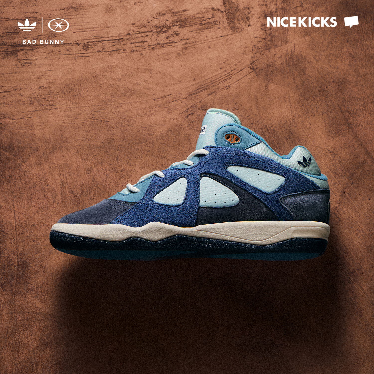 Blue and teal sneaker on a textured brown background.