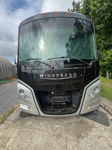 Head-on Winnebago front cap open lower grille radiator mechanical components marker lights David's 2022 Winnebago Adventurer 35F Conductor's Special 232 gallery photo 2