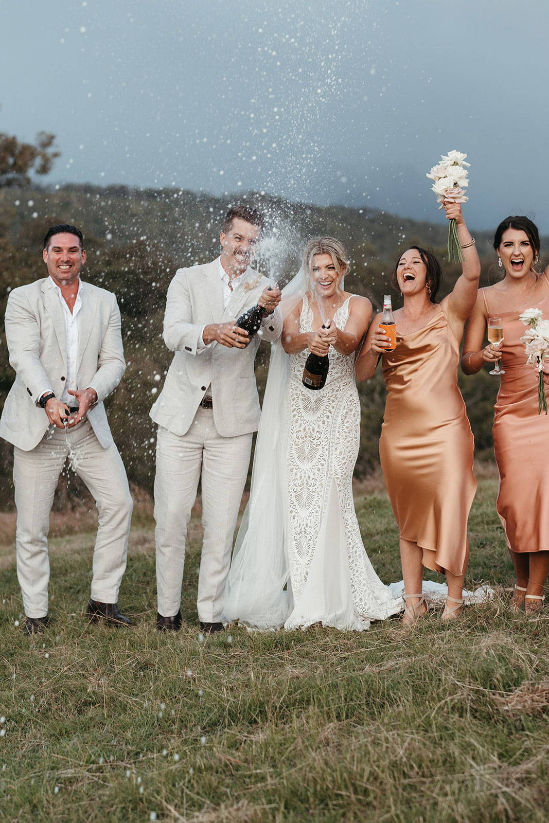 Bridal party celebrating with champagne