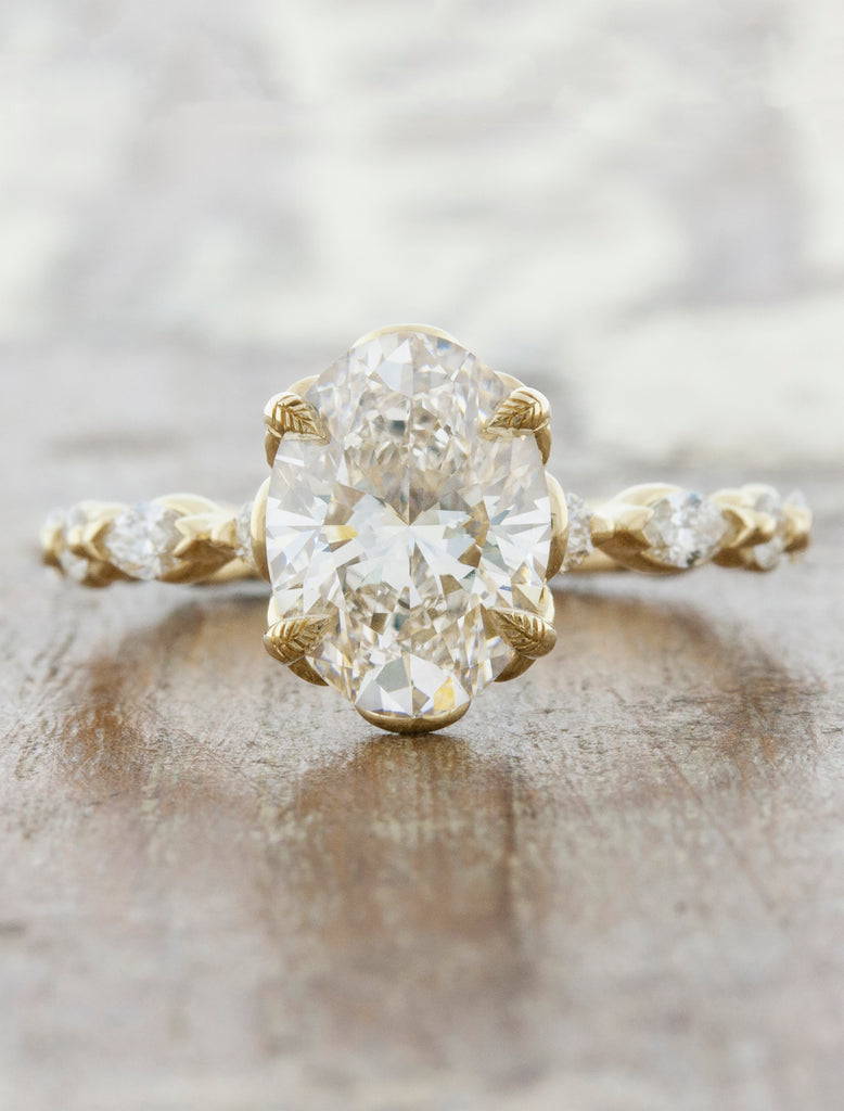 four leaf prong yellow gold ring with oval diamond