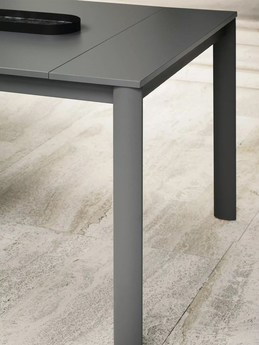Gray Etico Plus Extendable Table by Bontempi with a black object on top, against a light floor.
