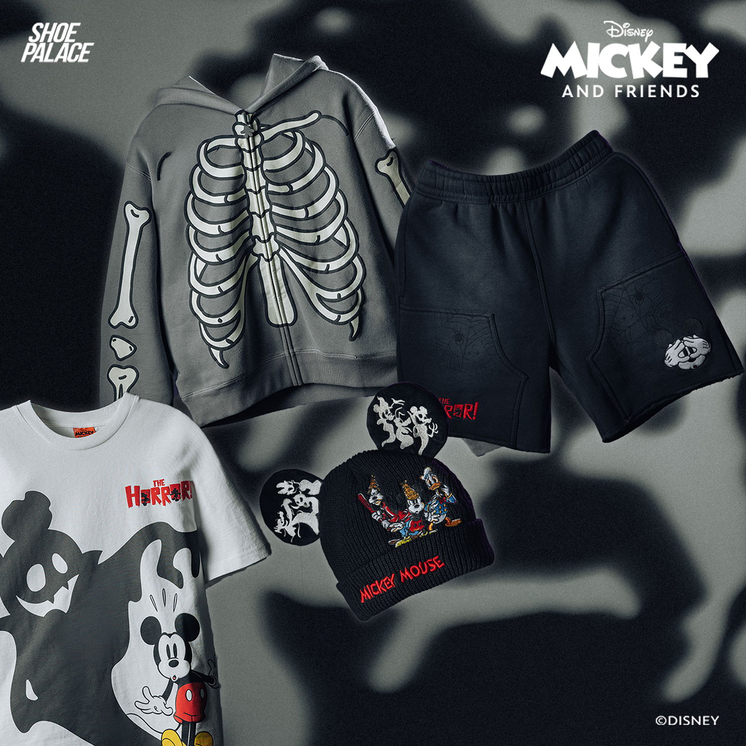 Mickey and Friends themed clothing, including a skeleton hoodie, shorts, and beanie.