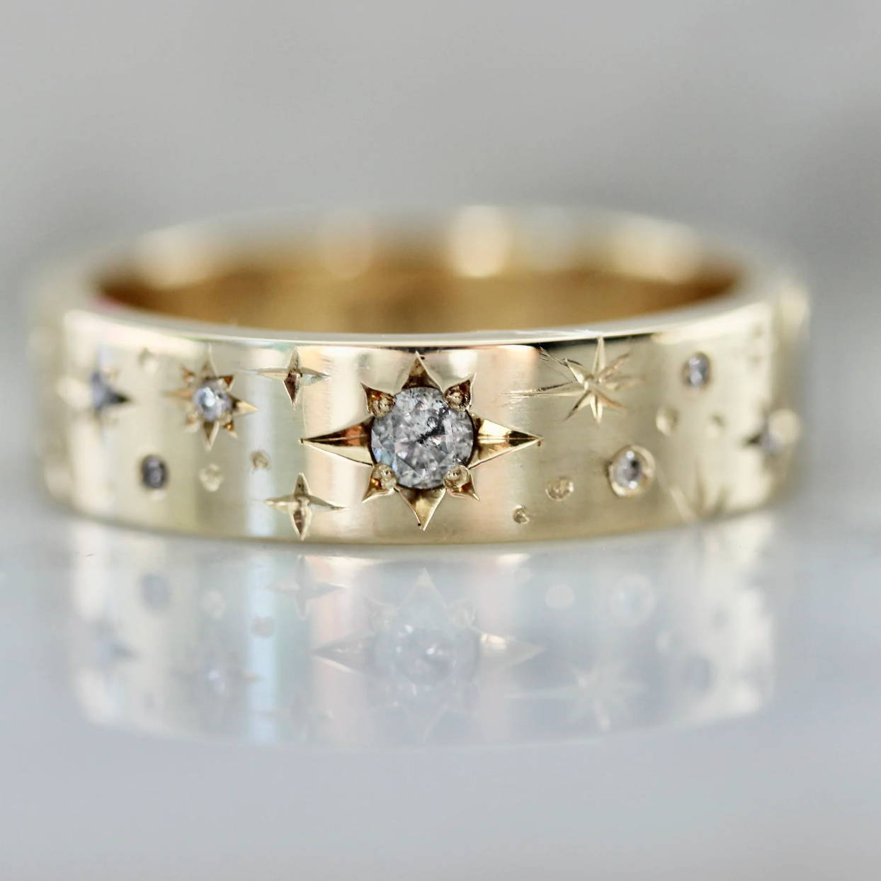 Gold band with star inset diamonds