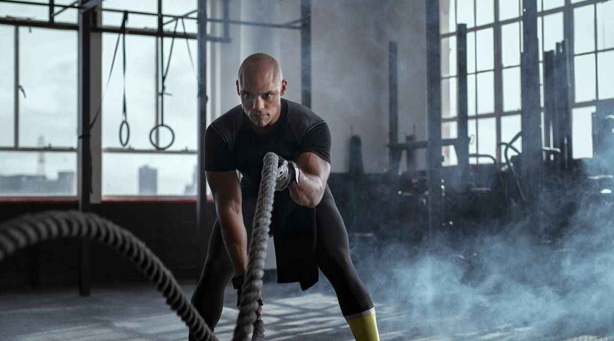 fit athletic man battle ropes workout|why do you need glutamic acid