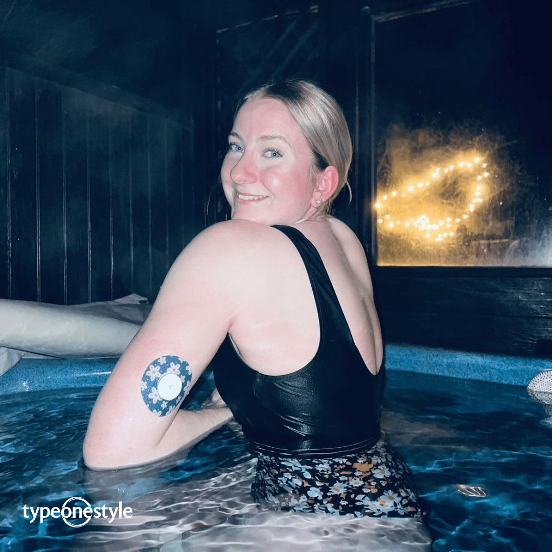 A person wearing a waterproof CGM patch in a pool.