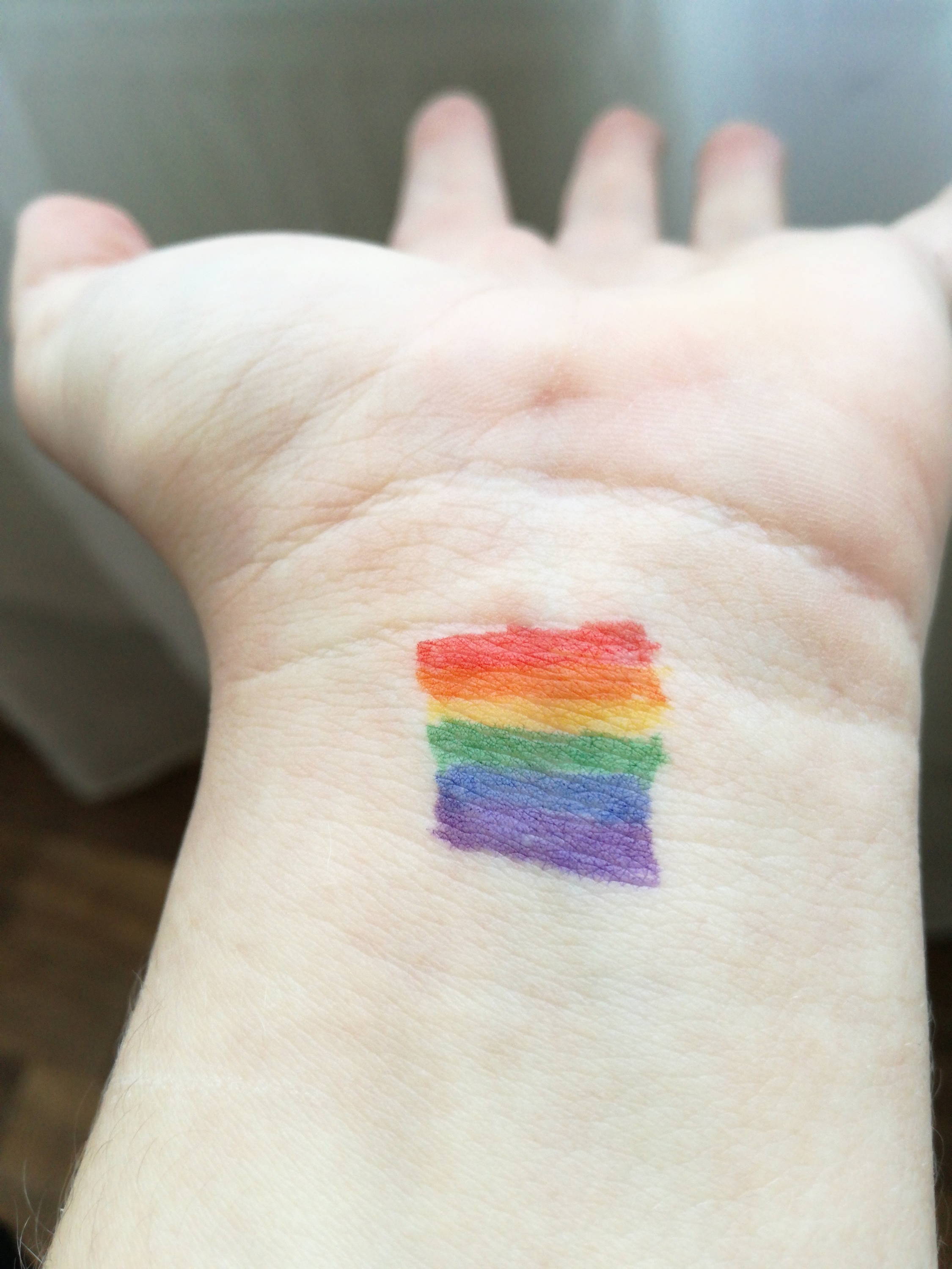 girl hand with pride flag 